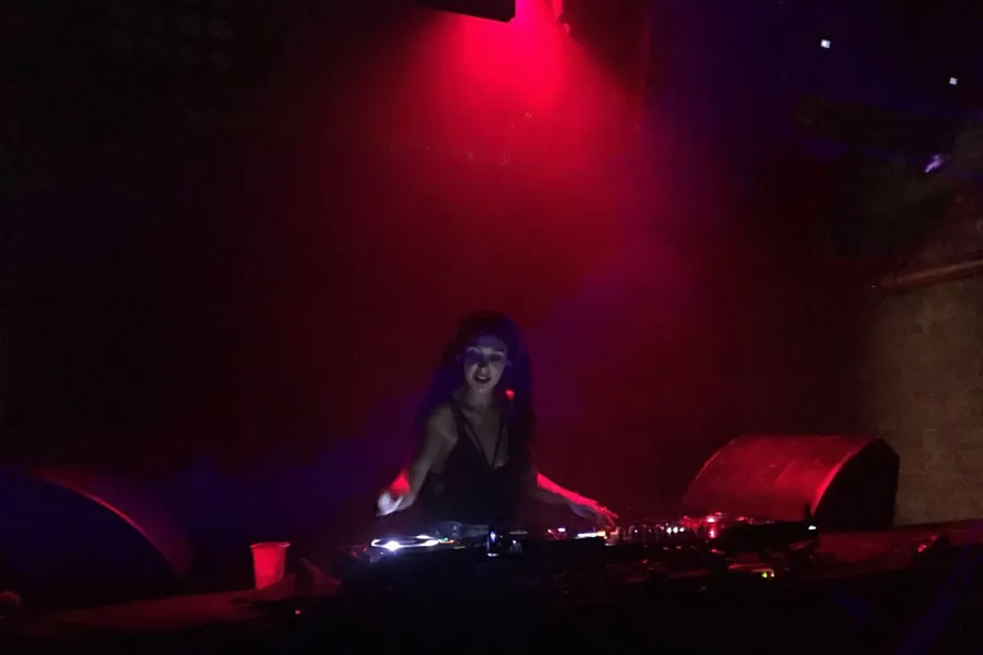 Lily Rivers in the booth, late in the night